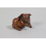 A Carved Wooden Netsuke in the Form of A Recumbent Portly Pig Scratching Ear, Signed 3cm high