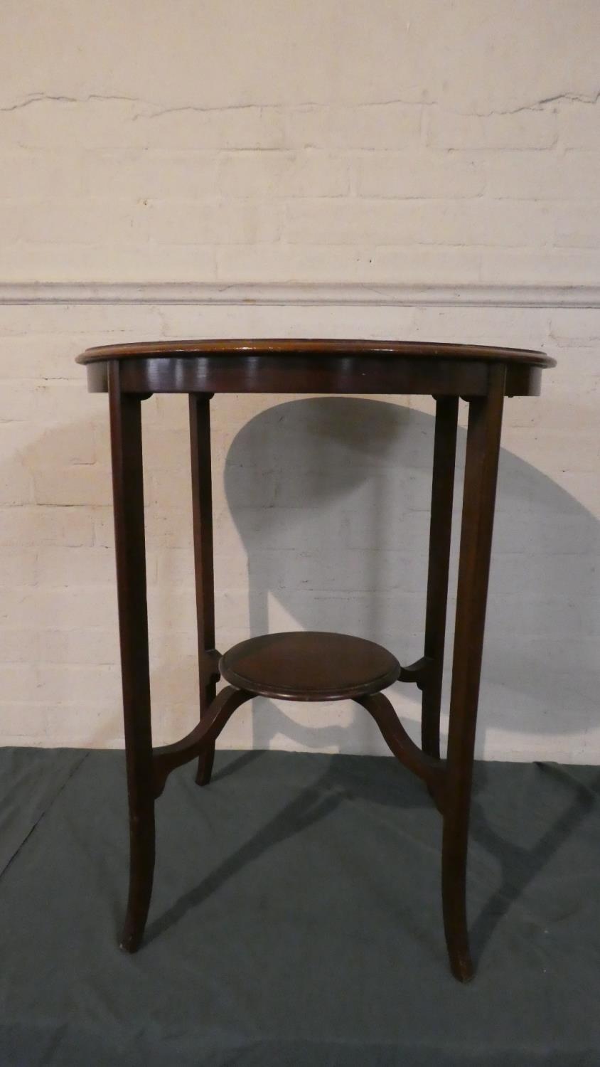 An Edwardian Circular Topped Occasional Table with Stretcher Shelf on Extended Cabriole Legs, 59cm