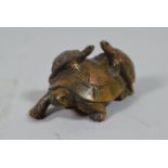 A Carved Wooden Netsuke in the Form of Three Tortoises, 5cm Wide