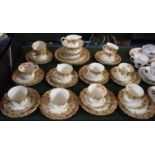 An Edwardian Teaset Comprising Twelve Trios, Two Cake Plates, Cream and Sugar