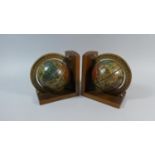 A Pair of Wooden Bookends Decorated with Table Globes