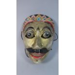 A Siamese Carved and Painted Wood Theatre Mask of a Man with Bulging Eyes and Mustache. 20x15cms