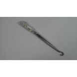 A Silver Button Hook with Lion Mask Handle. Birmingham 1911