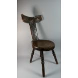 An Arts and Crafts Oak Framed Spinning Chair with Copper Mount to Splat and Top Rail Decorated in