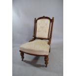 A 19th Century Mahogany Framed Easy Chair with Upholstered Back and Seat. Supported on Carved Turned