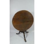 An Oak Snap Top Occasional Table. 89cms Diameter