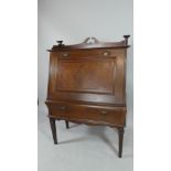 An Edwardian Mahogany Fall Front Cocktail Cabinet with Label for MD Miller and Sons, Nottingham.