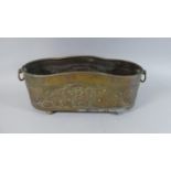 A Hand Beaten Brass Planter decorated with Grapes and Vine Leaves. Two Ring Carrying Handles