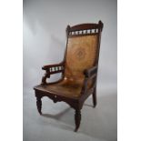 An American Arts and Crafts Walnut Armchair with a Formed Plywood Back and Seat with the Original