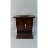 A 19th Century Varnished Pine Collectors or Jewellery Cabinet with a Brass Carrying Handle over a