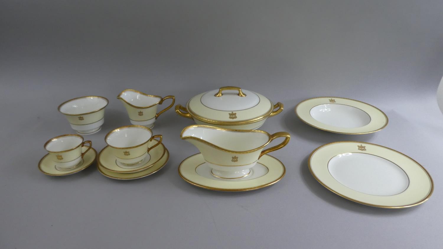 A Large Collection of Royal Worcester Gilt and Pale Yellow Armorial Dinner, Tea and Coffee Wares