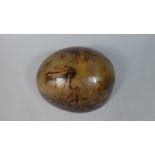 An Interesting Carved Nut Shell Decorated with the Image of Birds and a Monkey 20x18cms