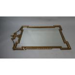 An Alsonea Gilt Framed Pier Mirror with Vase and Swag Mounts to Sides. 102x61cms Wide.