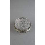 A Carved Chinese Lidded Circular Rock Crystal Box with Silver Collar and Hinge Relief Decoration.
