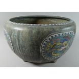 A Large Oriental Bronze Singing Bowl on Three Feet with Four Enamelled Cartouches and Enamelled