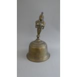 An Indian Brass Hand Bell with Hand Engraved Decoration depicting Hunting Scenes and Figural Handle.