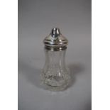 A Silver Topped Glass Sugar Sifter, 13cm High