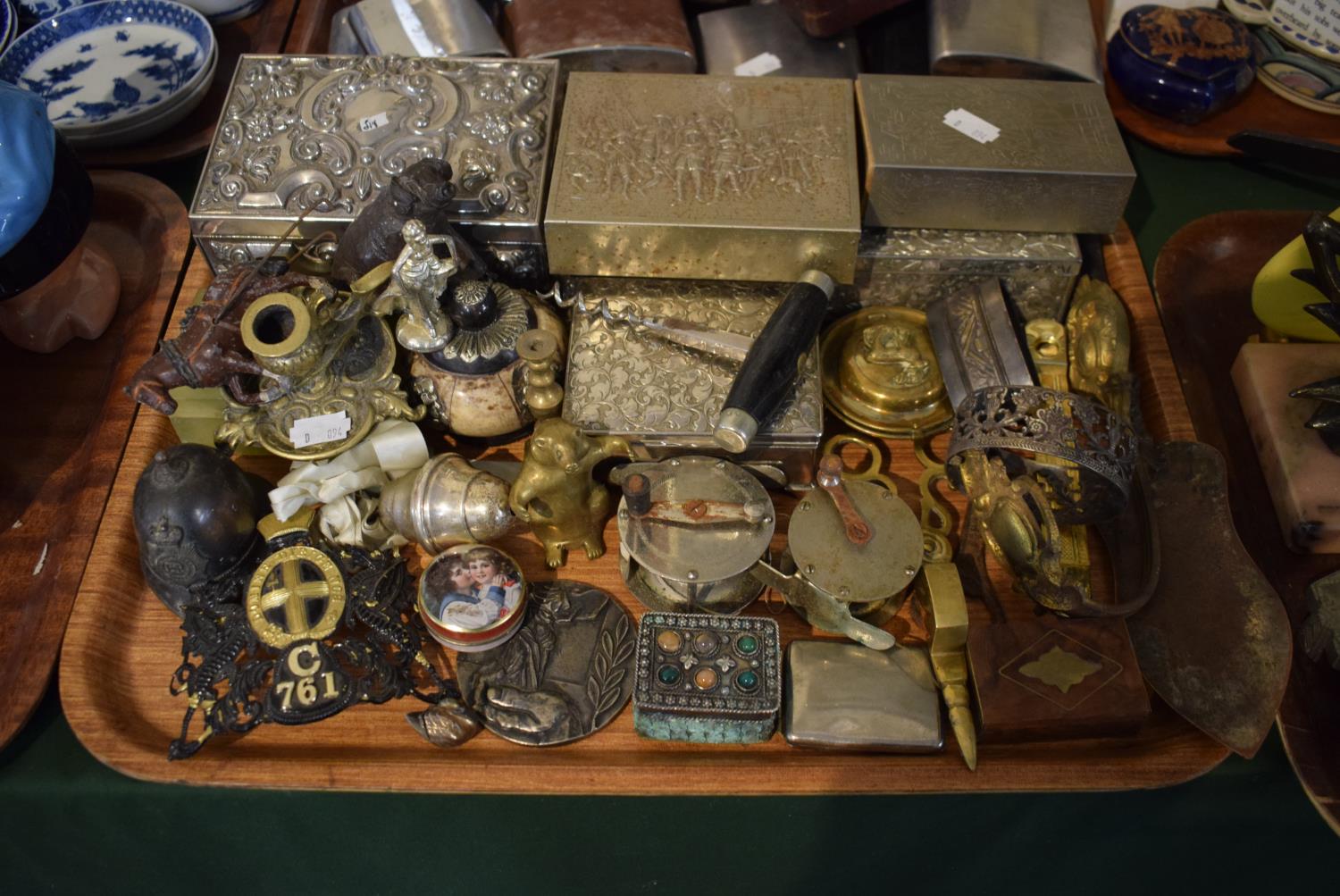 A Tray of Curios to include Policemans Helmet Bell, London Police Badge, Silver Plated Cigarette