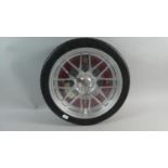 A Modern Novelty Wall Clock in the Form of a Sports Car's Alloy Wheel, 35cm Diameter, Working Order