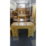 A Bow Fronted Satinwood Desk or Dressing Table together with Chair 115cms Wide