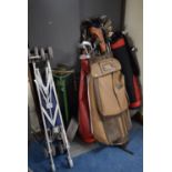 A Collection of Three Golf Bags, Golf Clubs, Trolleys Etc