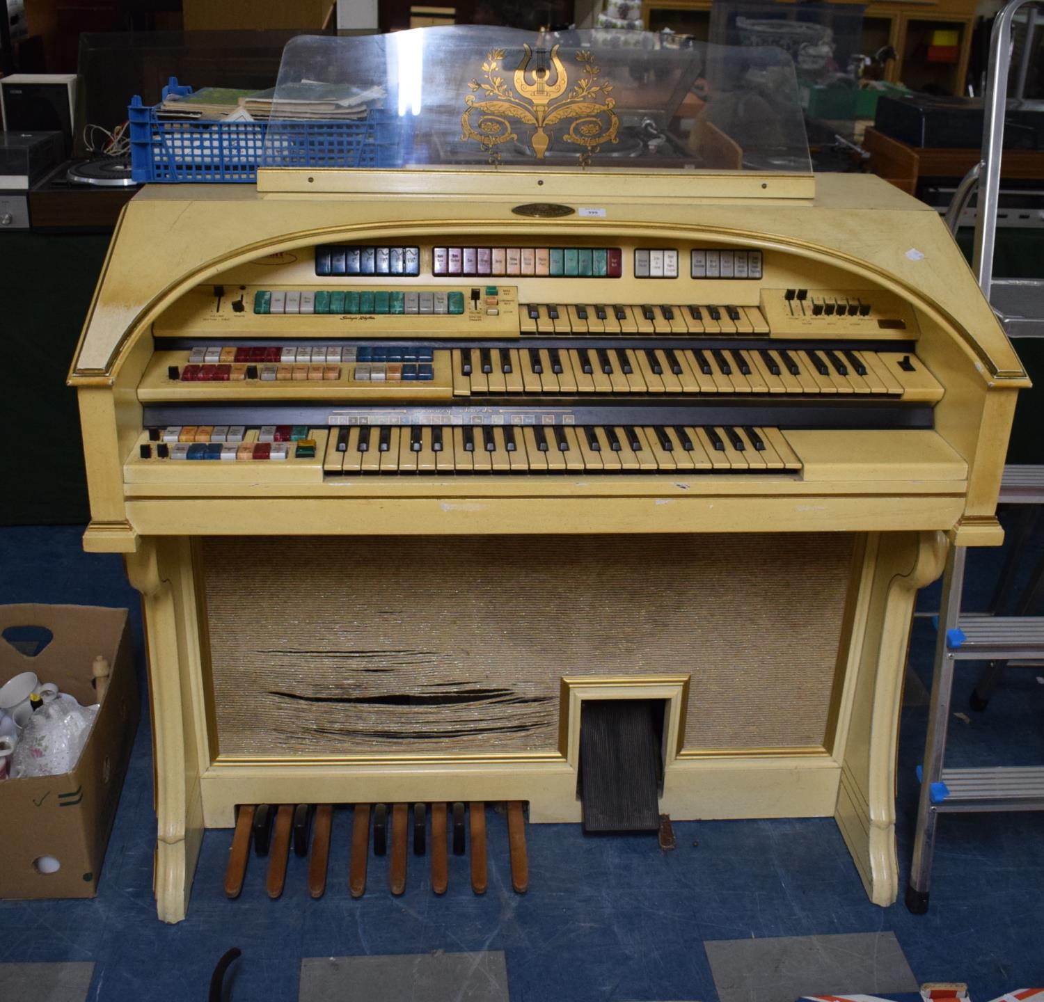 A Wurlitzer Electric Organ and Collection of Sheet Music