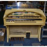 A Wurlitzer Electric Organ and Collection of Sheet Music