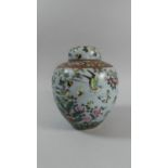 An Oriental Lidded Ginger Jar with Applied Decoration Depicting Bird, Butterfly and Insects Among