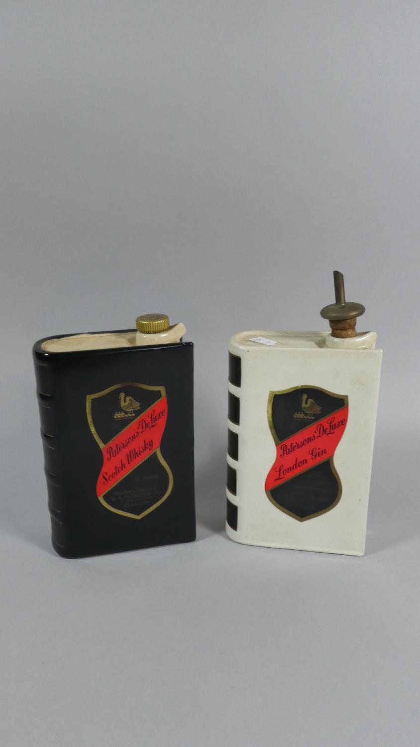 A Pair of Patersons' Ceramic Decanters in the Form of Books, for Scotch Whisky and London Gin,