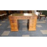An Edwardian Kneehole Writing Desk with Tooled Leather Top Having Three Drawers Under and Two