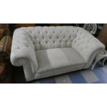 A Buttoned Upholstered Chesterfield Settee
