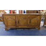 A Modern Sideboard with Three Panelled Doors, Bracket Feet, 157cm Wide