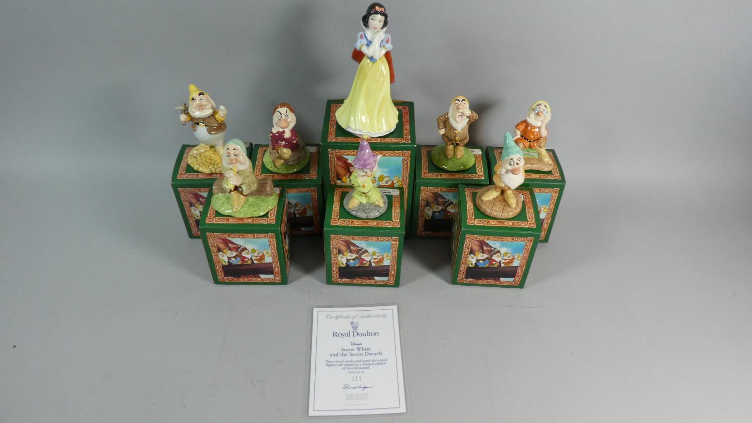 A Collection of Royal Doulton Snow White and the Seven Dwarves with Certificate and Boxes