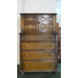 A Mid 20th Century Oak Tallboy with Shelved Cupboard Over Four Drawers to Base, 80cm Wide