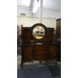 An Edwardian Mahogany Mirrored Back Breakfront Sideboard with Three Centre Drawer Flanked by