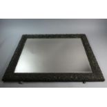 A Rectangular Wall Mirror with Bevelled Glass Relief Decorated Frame, 73cm x 56cm