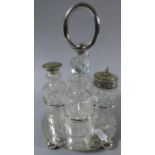 A Silver Plated Four Bottle Cruet with Bun Feet, 23cm high