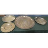 A Collection of Four Brass Circular Trays
