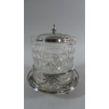 An Edwardian Cut Glass Cylindrical Biscuit Barrel Set in Silver Plated Stand with Lid, 19cm High