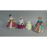 A Collection of Four Figural Ornaments, Royal Worcester Winter Walk, Paragon Lady Marilyn, Royal
