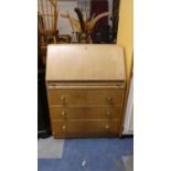A Mid 20th Century Fall Front Bureau with Three Base Drawers, 76cm Wide