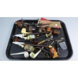 A Tray Containing Various Continental Vintage Ceramic and Wooden Pipes