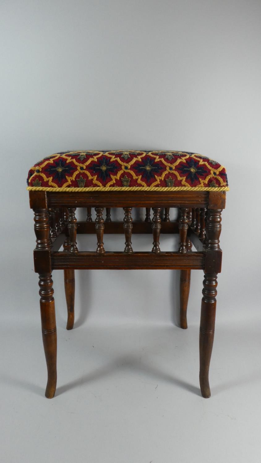 A Late 19th Century Mahogany Framed Upholstered Rectangular Stool with Turned Supports and Spindles,