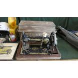 A Cased Singer Sewing Machine