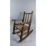 A 19th Century Child's Rocking Armchair