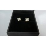 A Pair of Diamond Clip Earrings Each Consisting of Four Diamonds Each Approximately .1ct