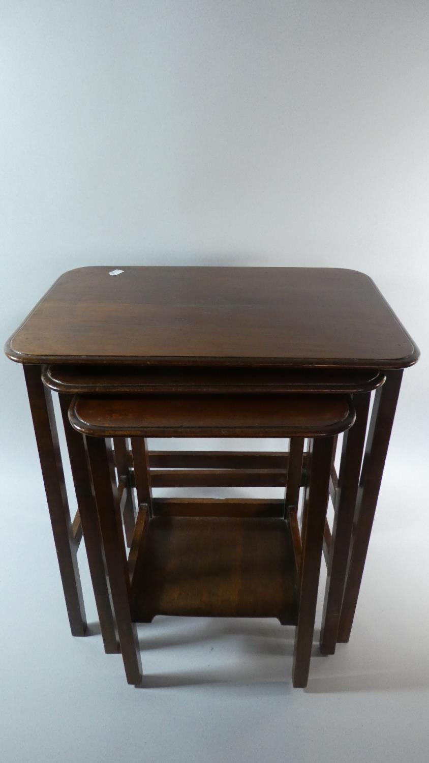 A Nest of Three Edwardian Mahogany Tables, the Longest 48.5cm Wide