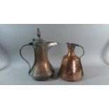 Two North African Copper Ewers One with Hinged Lid, the Tallest 45cm High