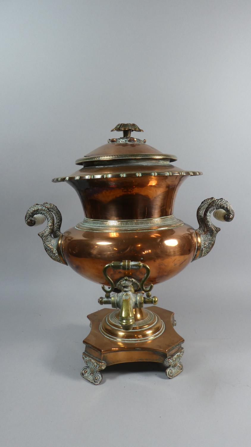 A Late 19th Century Copper Samovar with Brass Tap and Opaque Glass Handles. 44cm High