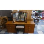 A Stag Kneehole Six Drawer Dressing Table with Triple Mirror and Stool